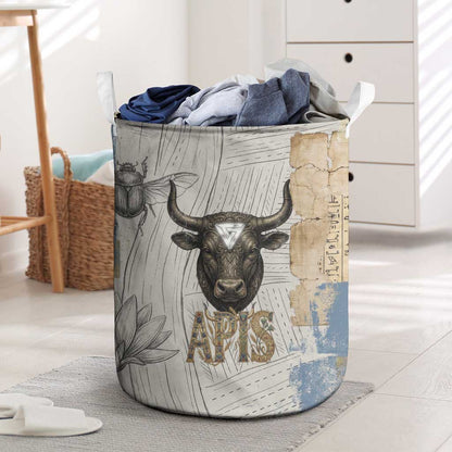 Apis Ancient Egyptian Laundry Basket with Beige-Gray Hieroglyphic, Ornate Bull Head, and Gold-Blue Typography - African Pride