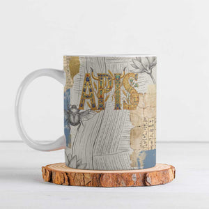 Apis Ancient Egyptian Ceramic Mug with Beige-Gray Hieroglyphic, Ornate Bull Head, and Gold-Blue Typography - African Pride