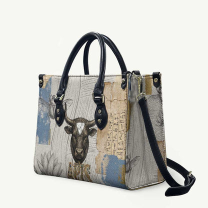 Apis Ancient Egyptian Leather Bag with Beige-Gray Hieroglyphic, Ornate Bull Head, and Gold-Blue Typography - African Pride