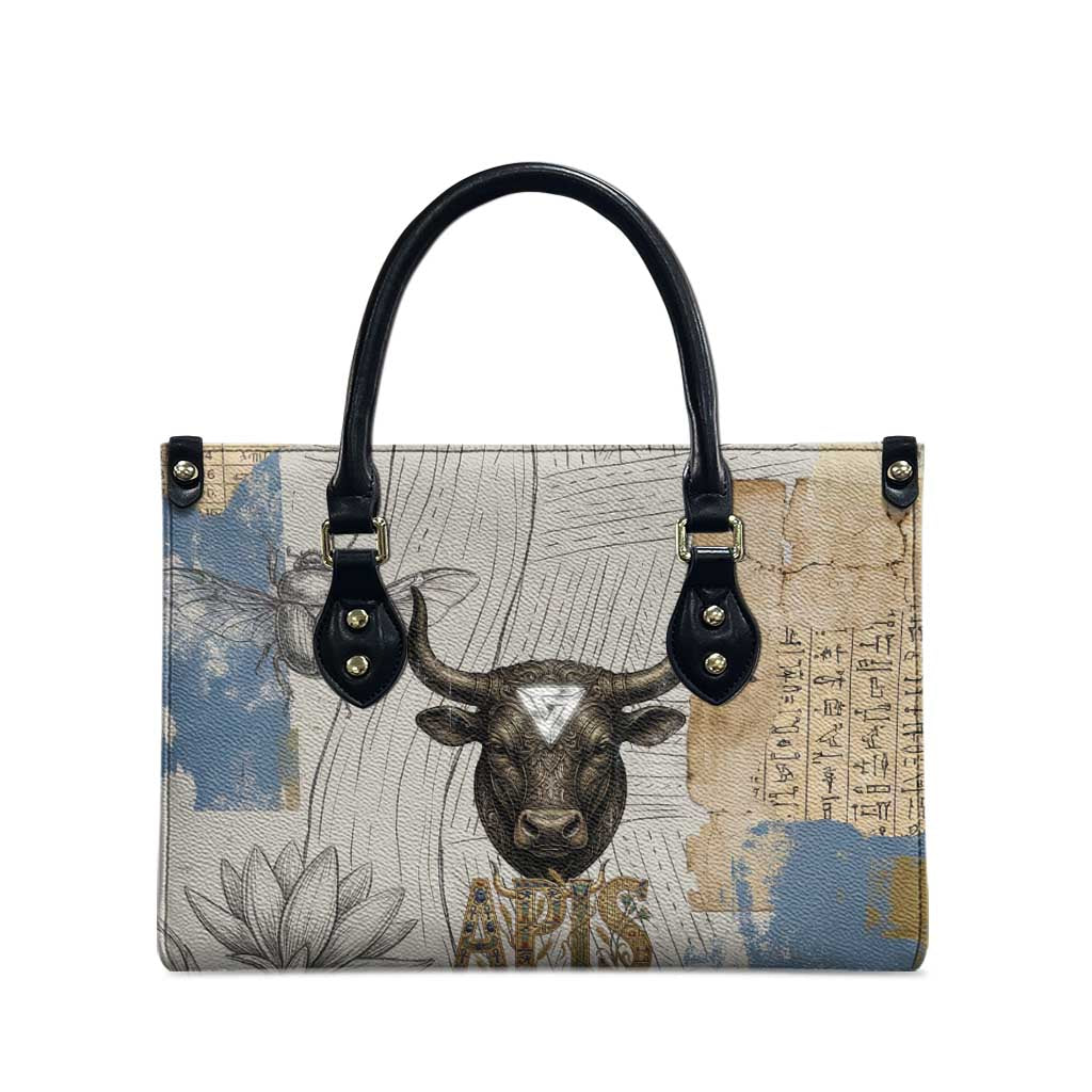Apis Ancient Egyptian Leather Bag with Beige-Gray Hieroglyphic, Ornate Bull Head, and Gold-Blue Typography - African Pride