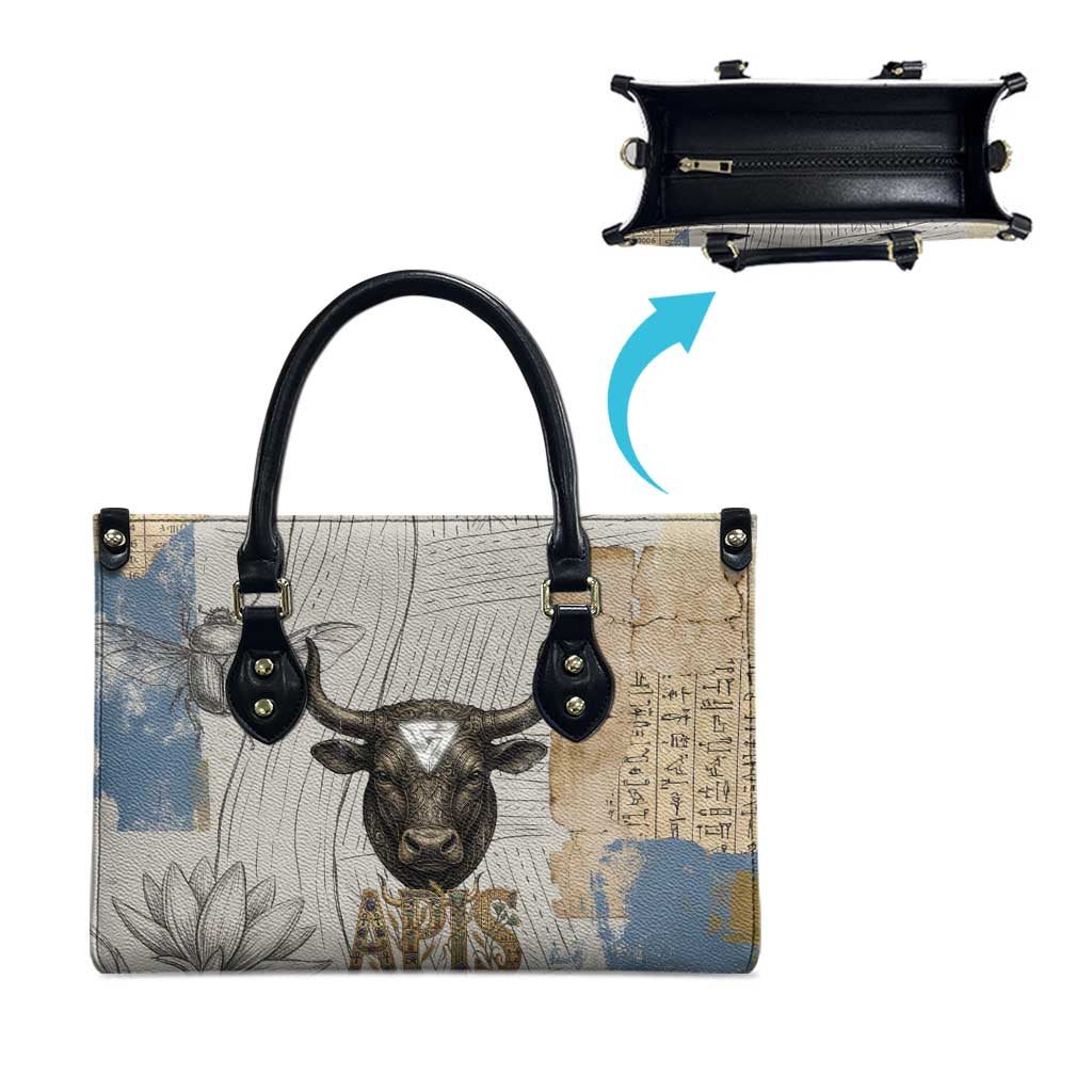 Apis Ancient Egyptian Leather Bag with Beige-Gray Hieroglyphic, Ornate Bull Head, and Gold-Blue Typography - African Pride