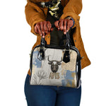 Apis Ancient Egyptian Shoulder Handbag with Beige-Gray Hieroglyphic, Ornate Bull Head, and Gold-Blue Typography - African Pride